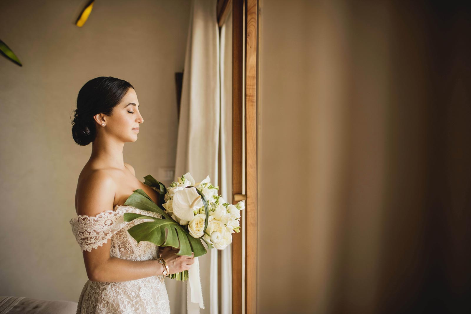 wedding in tulum, bride by the window