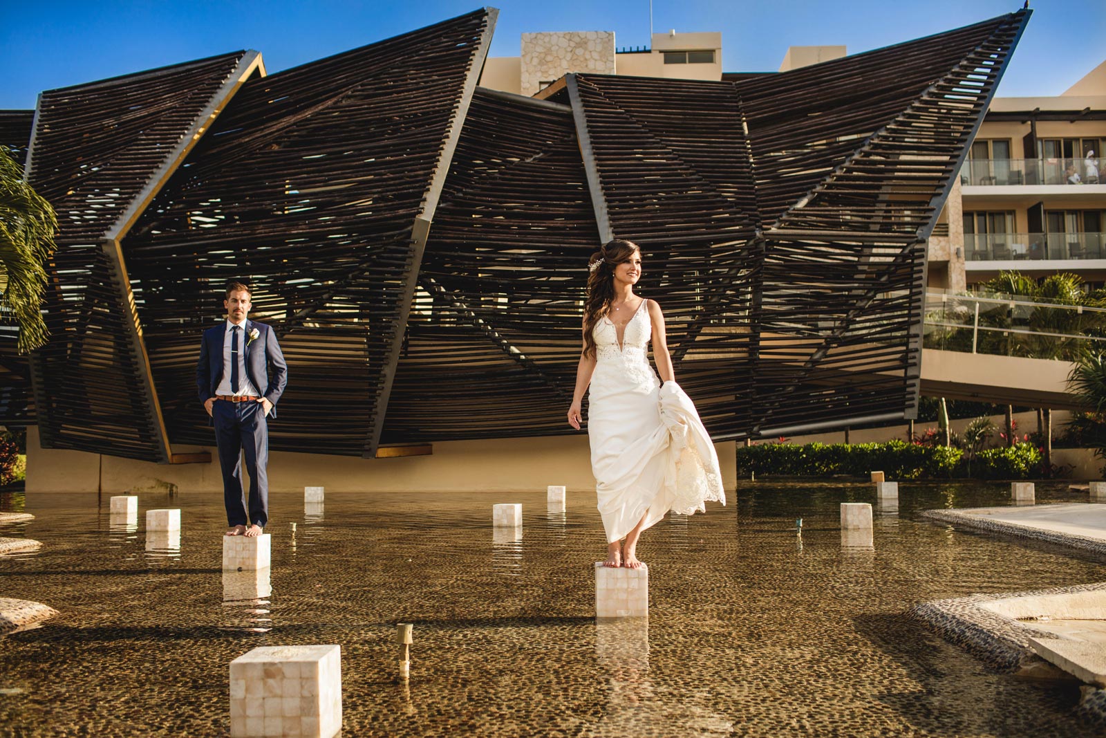 071-wedding-royalton-cancun-bride-groom-pond-cube